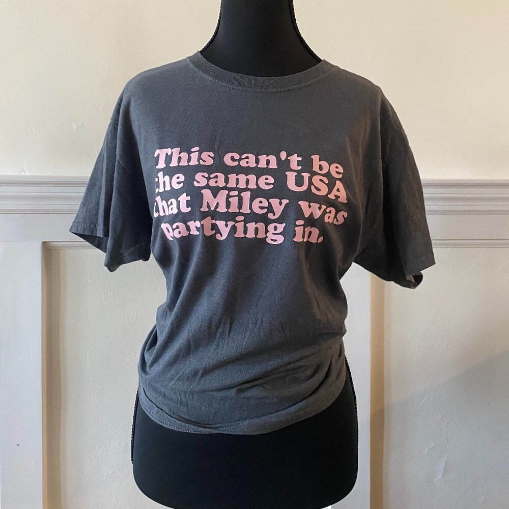 'This Can't Be The Same USA That Miley Was Partying In.' Gray T-Shirt